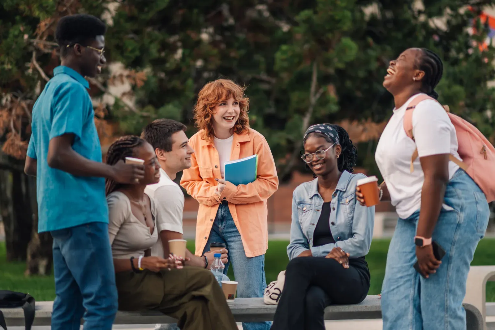 Group of college students talking on campus