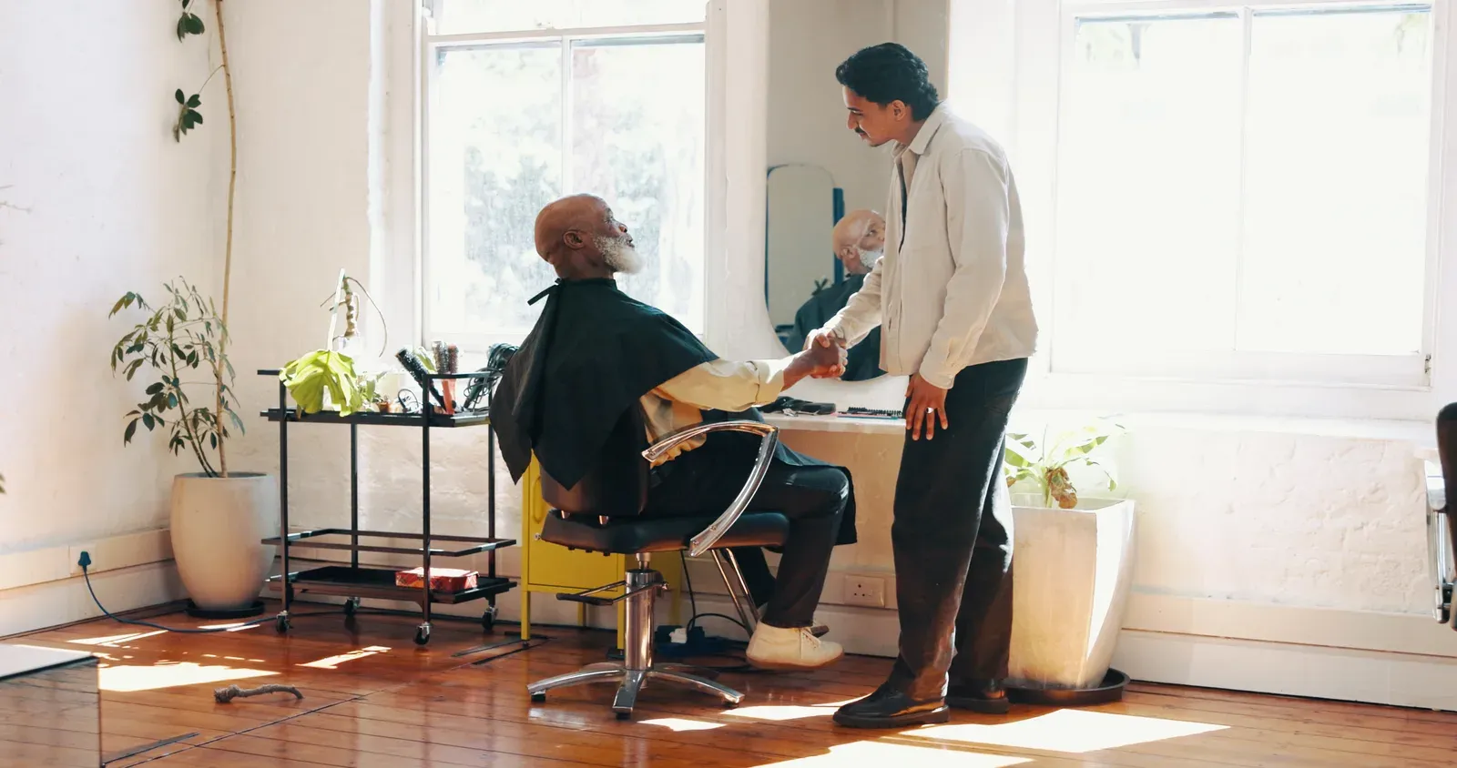 Barber and client talking through a haircut before starting